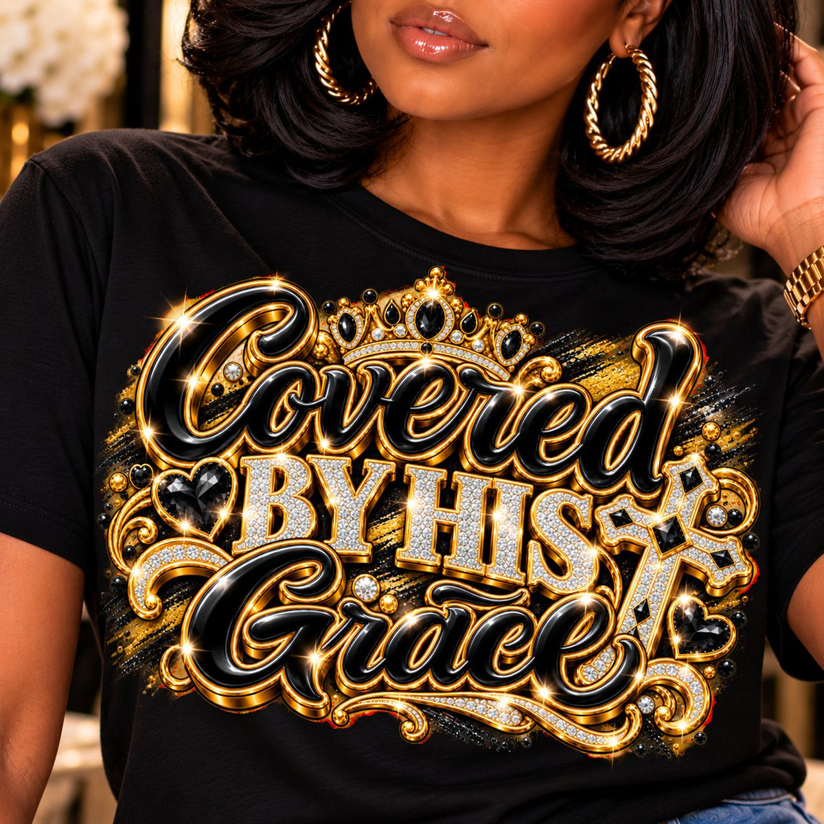 Covered by His Grace design in black and gold on a black T-shirt, close-up