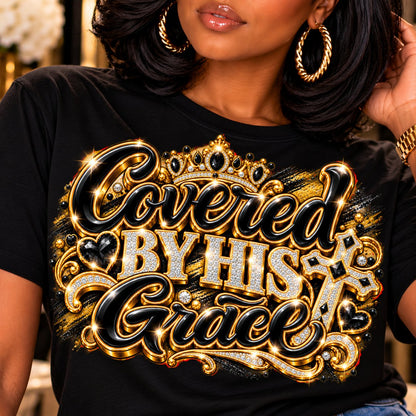 Covered by His Grace design in black and gold on a black T-shirt, close-up