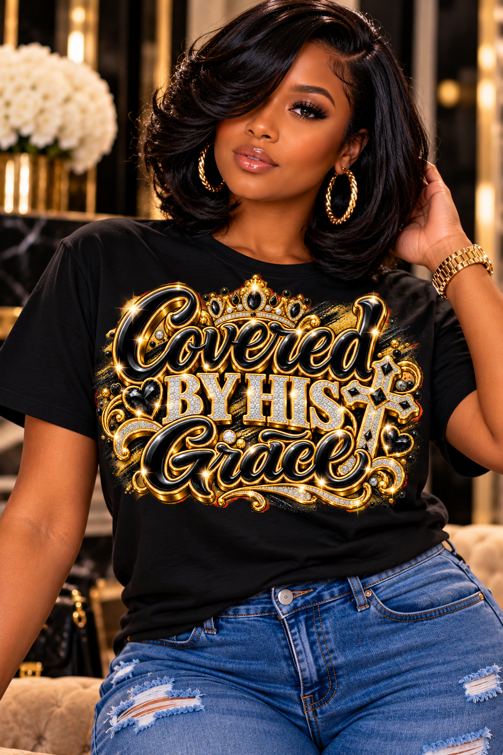 Covered by His Grace design in black and gold on a black T-shirt, seated