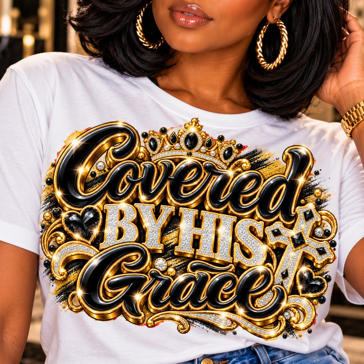 Covered by His Grace design in black and gold on a white T-shirt, close-up