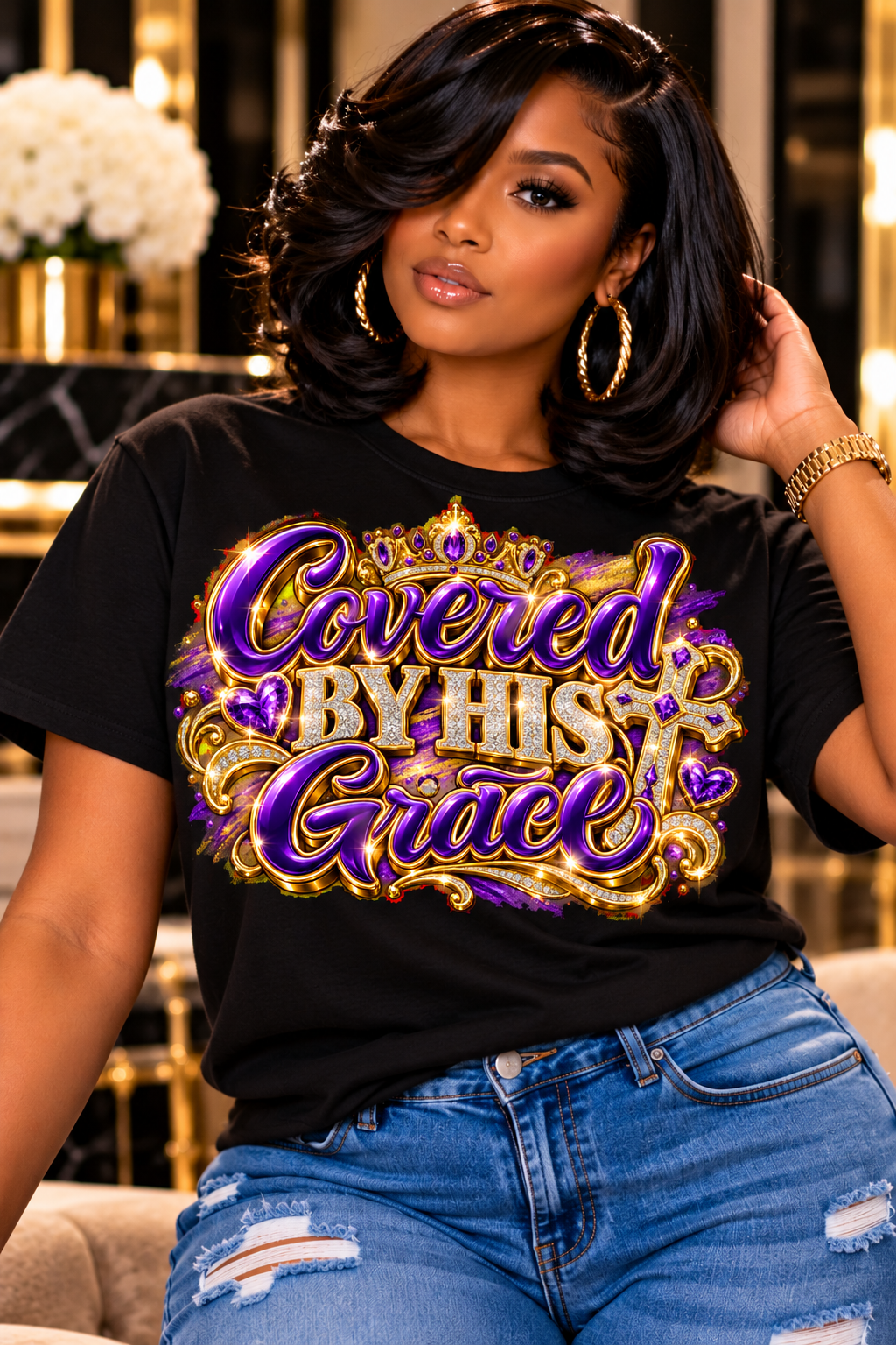 Covered by His Grace design in purple and gold on a black T-shirt, seated