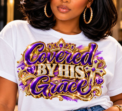 Covered by His Grace design in purple and gold on a white T-shirt, close-up