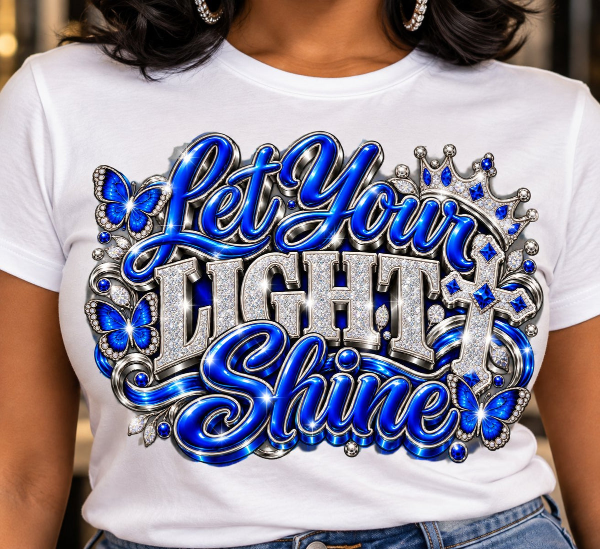 Let Your Light Shine design in blue and silver on a white T-shirt, close-up