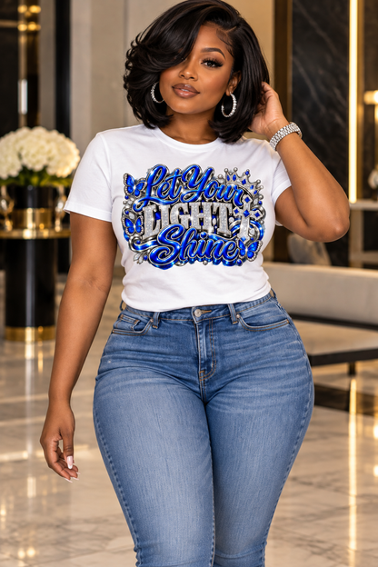 Let Your Light Shine design in blue and silver on a white T-shirt, standing