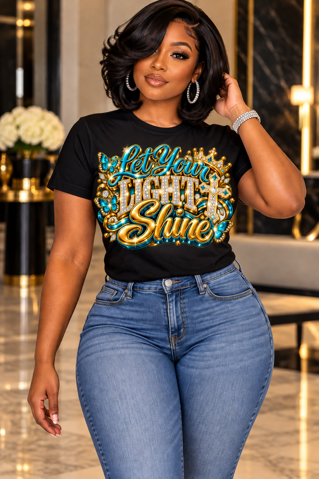 Let Your Light Shine design in turquoise and gold on a black T-shirt, standing