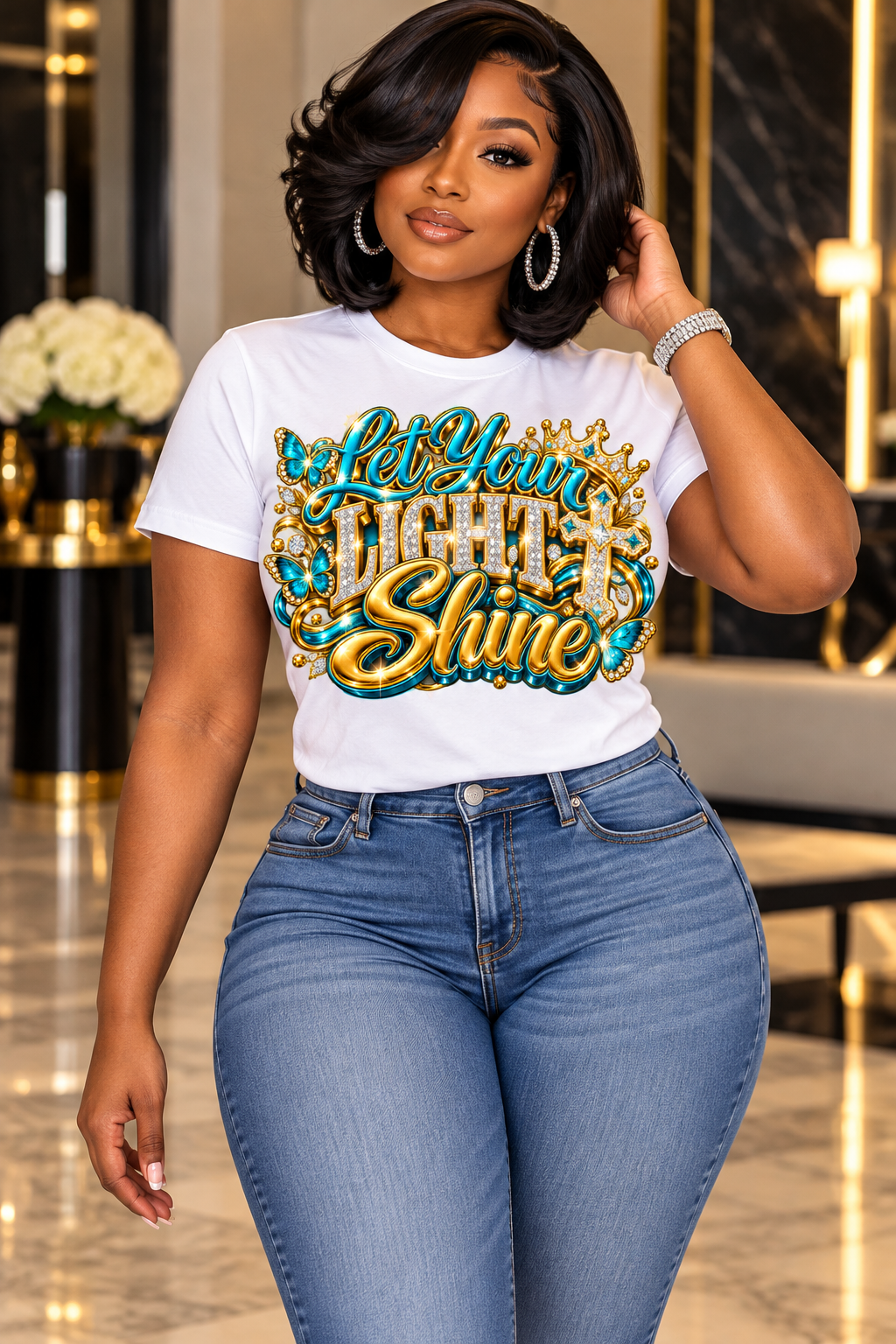 Let Your Light Shine design in turquoise and gold on a white T-shirt, standing