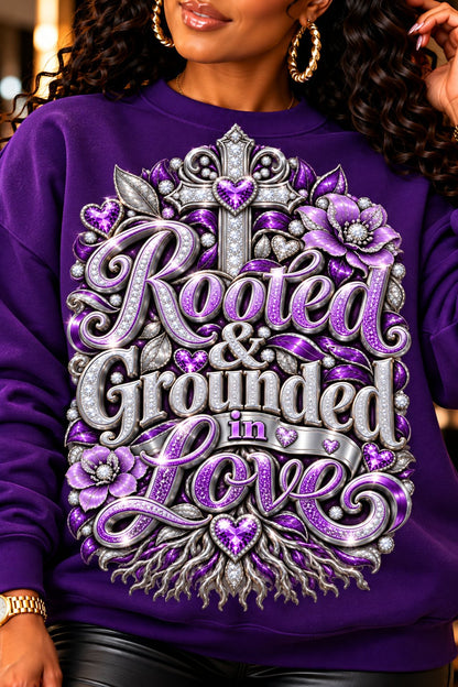 Rooted & Grounded in Love design in purple and silver on a purple sweatshirt